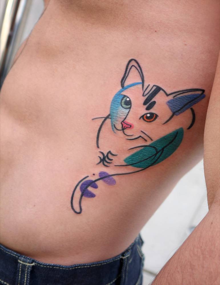 Pop art style cat portrait tattoo located on the rib.