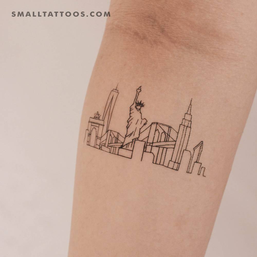 Fine line style NYC skyline temporary tattoo located on the inner forearm.