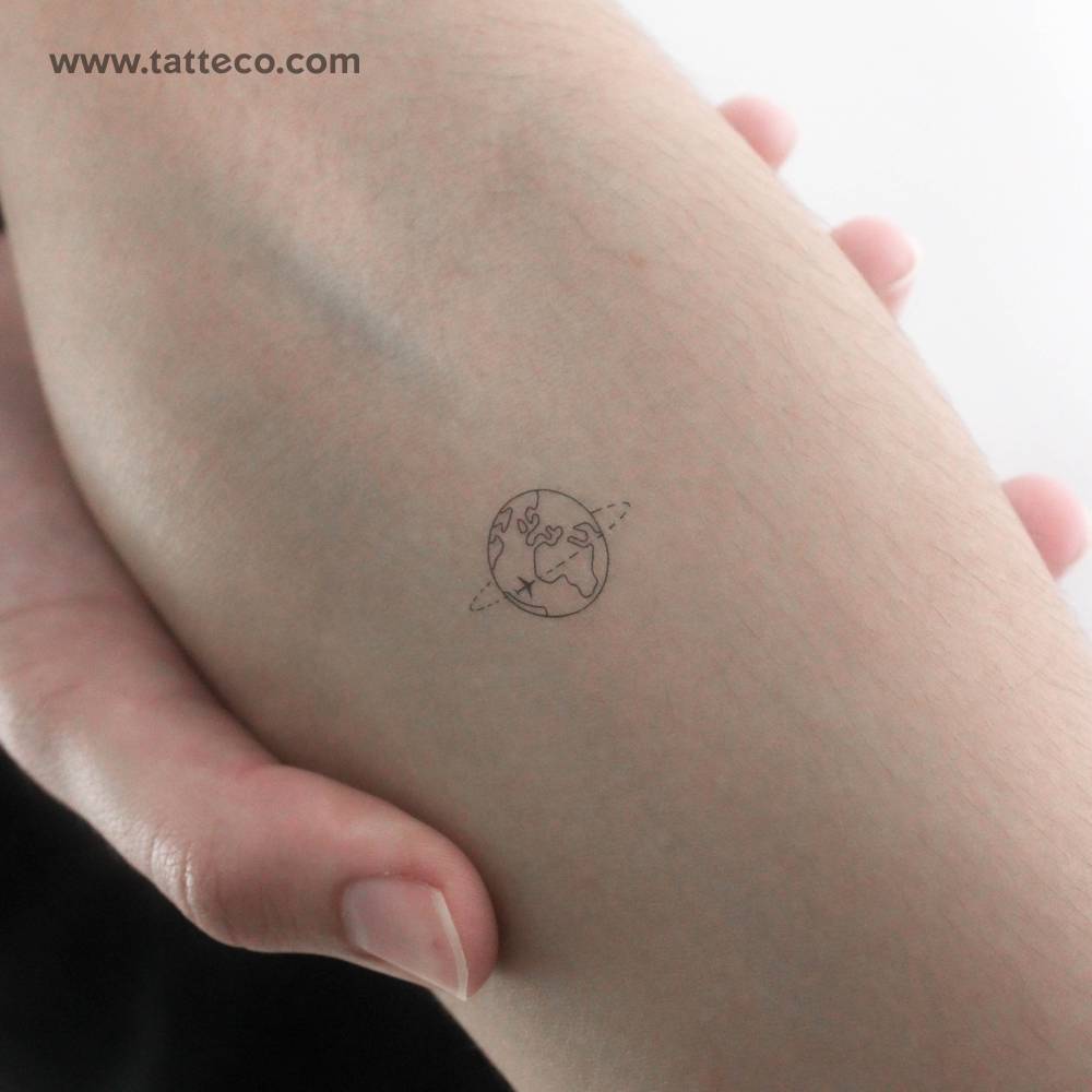 Flying around the world temporary tattoo located on the inner forearm.