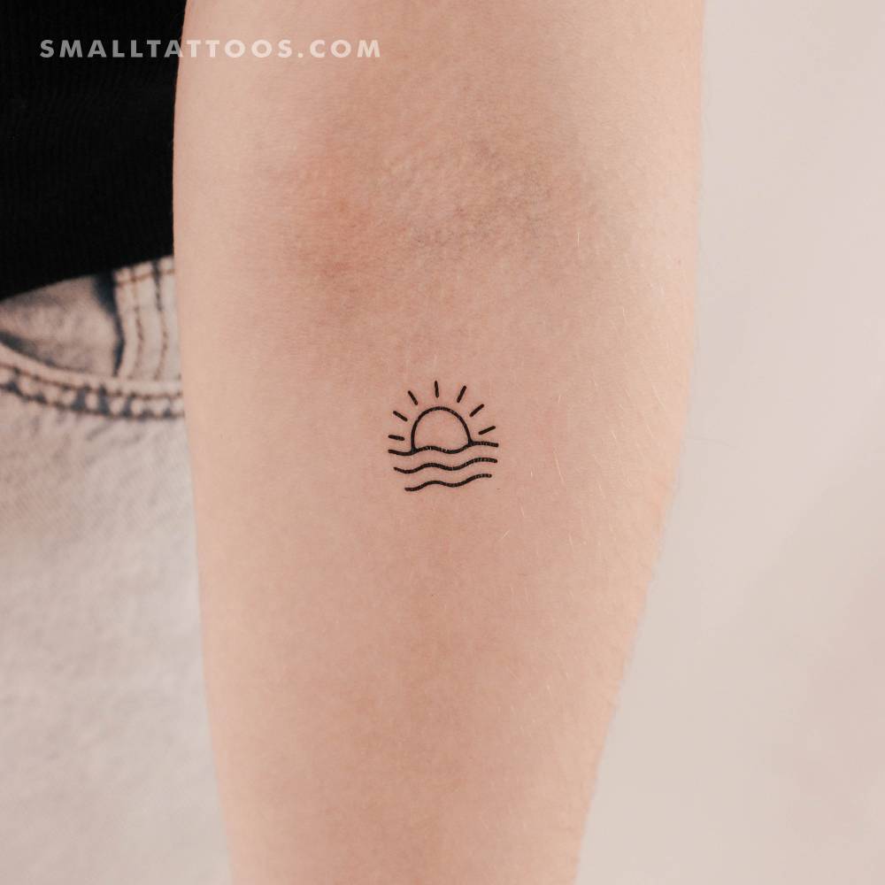 Sea sunset temporary tattoo located on the inner forearm.