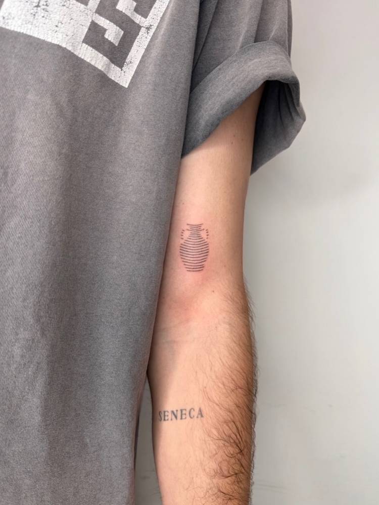 Amphora tattoo located on the upper arm.