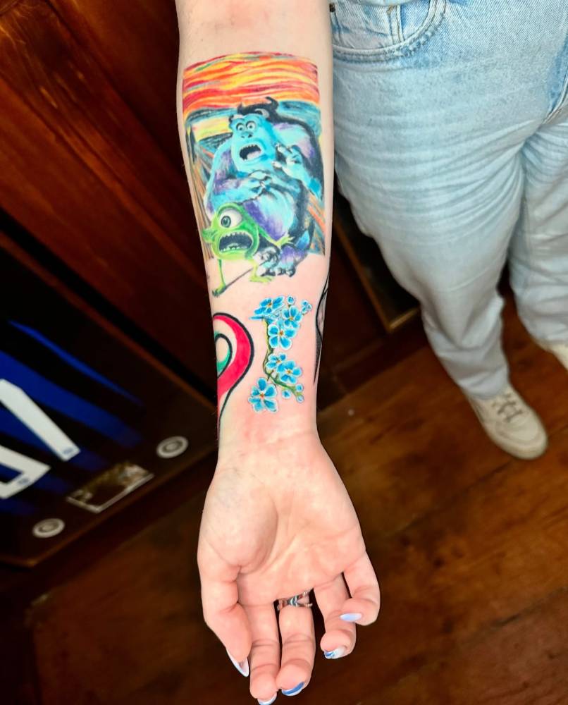 Forget-me-not tattoo in illustrative style located on the wrist.