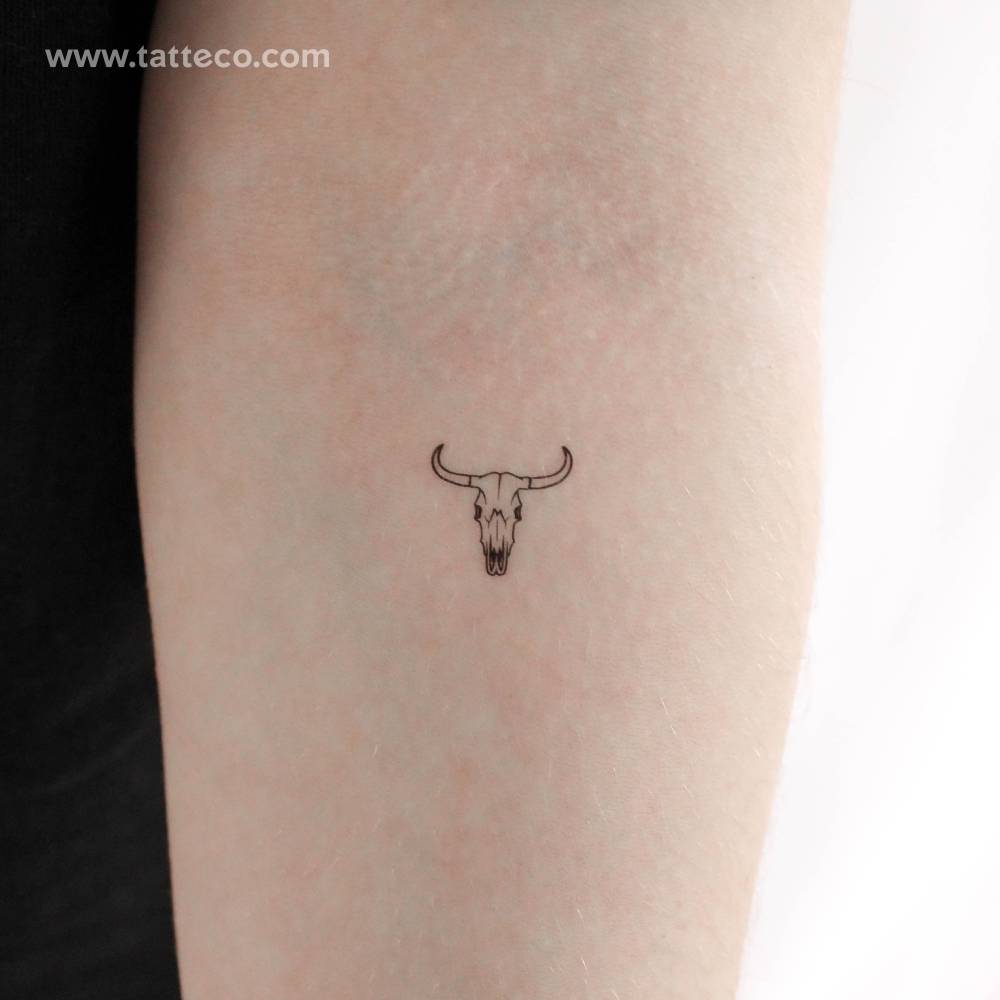 Cow skull temporary tattoo located on the inner forearm.