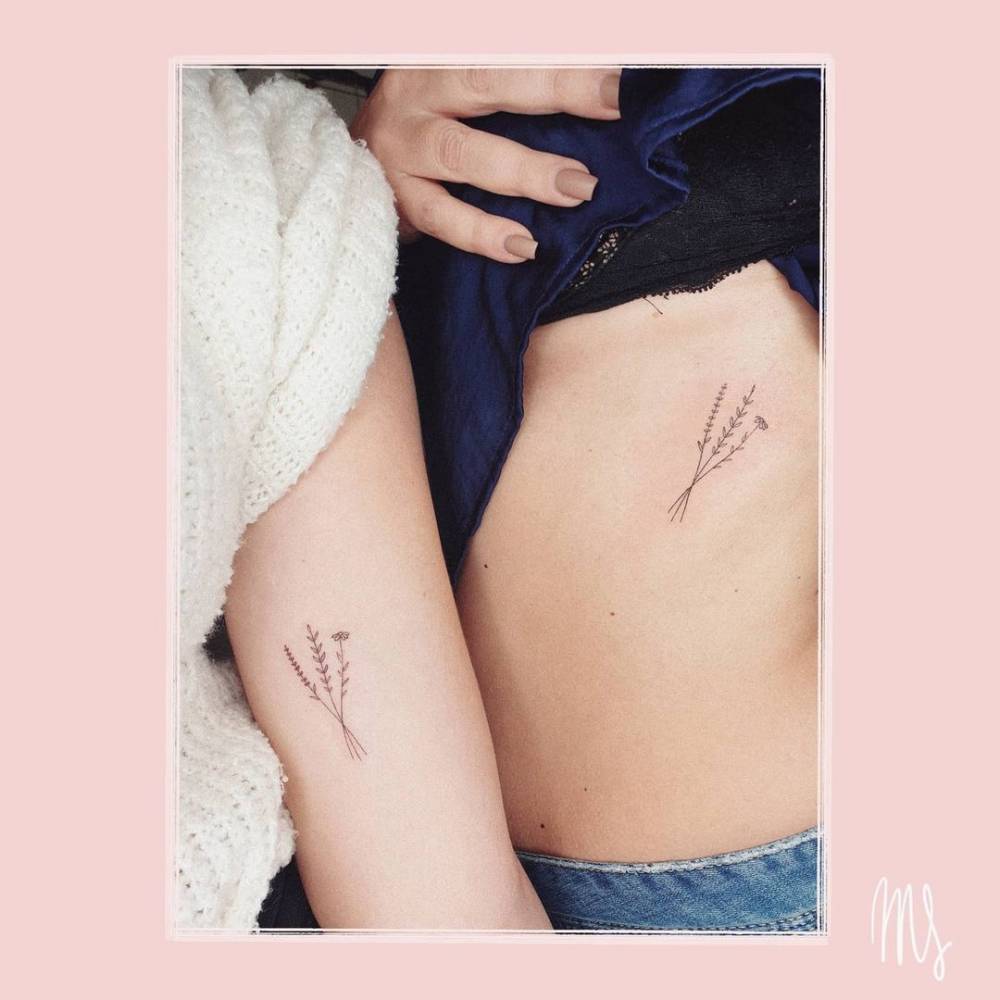Fine line matching flower bouquet tattoo for mother and daughter.