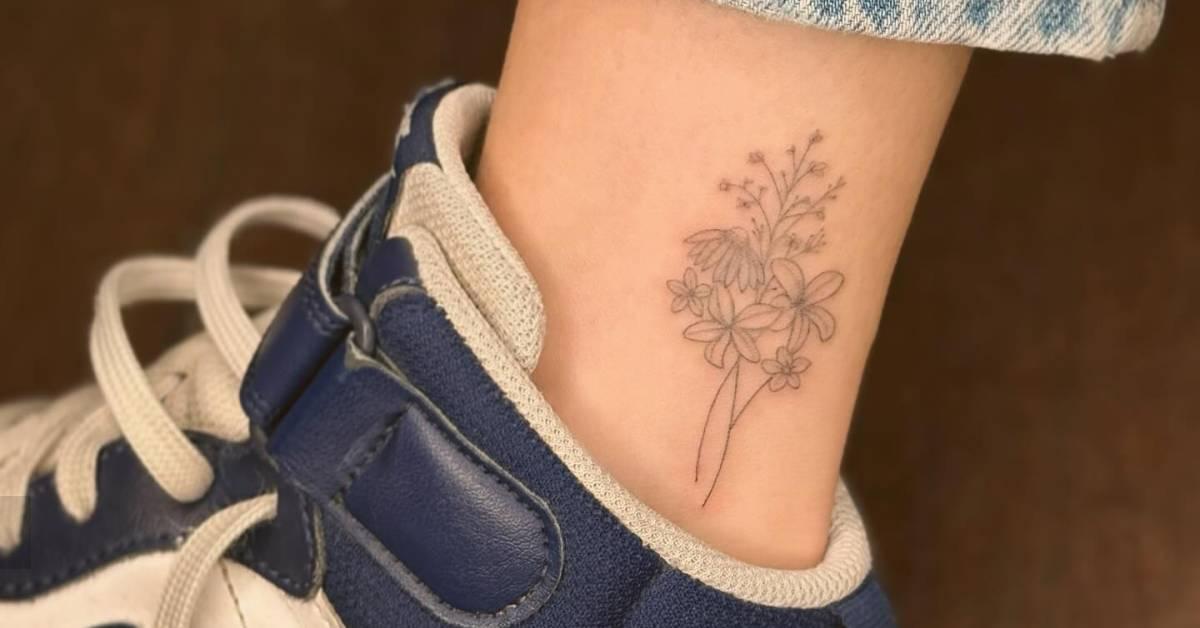 Fine line style flower bouquet tattoo done on the