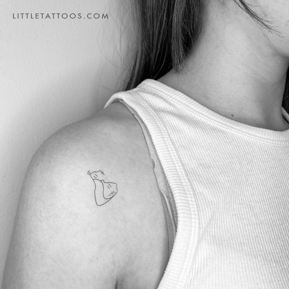 Love nap temporary tattoo located on the shoulder.