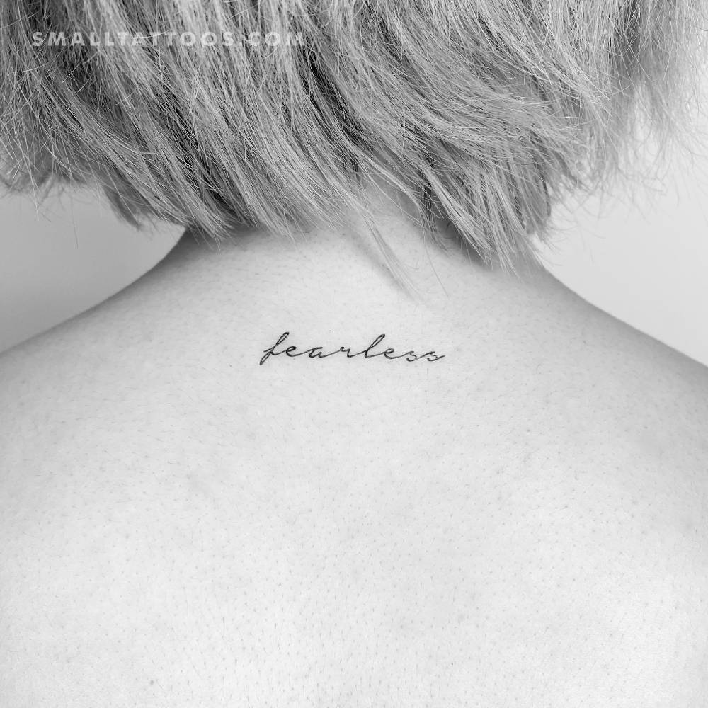 'Fearless' temporary lettering tattoo located on the upper back.