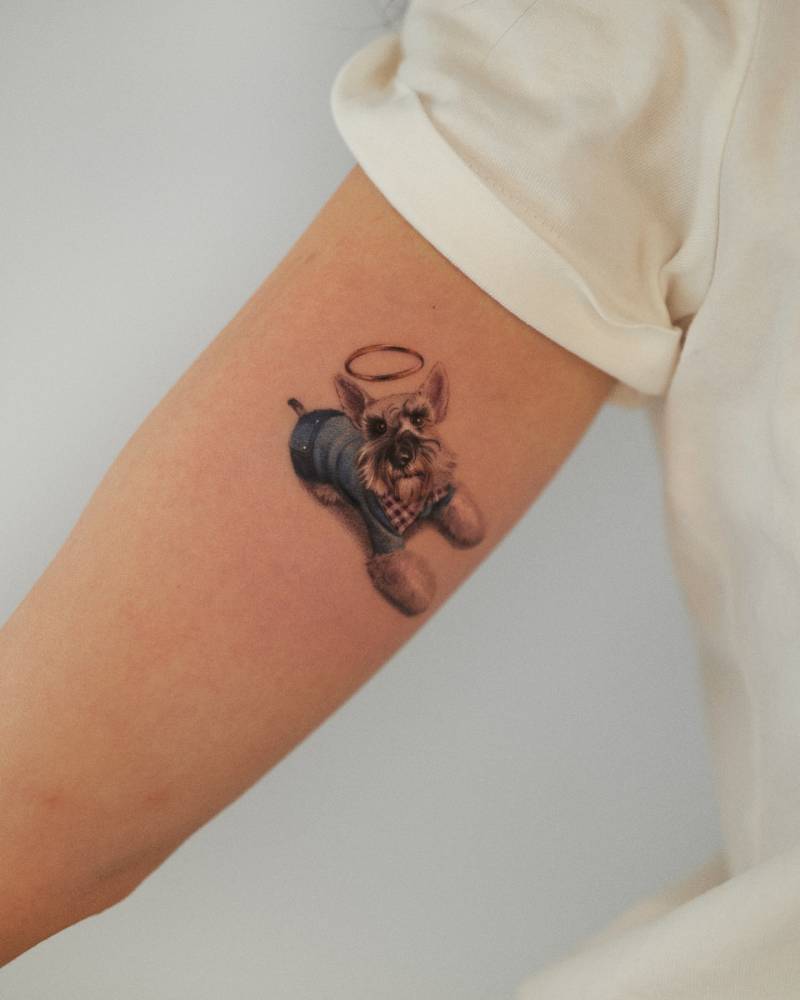 Memorial Schnauzer tattoo in micro-realistic style located on the inner arm.