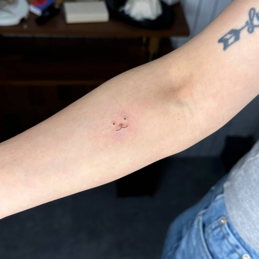 Bunny face birthmark cover up tattoo located on the inner forearm.