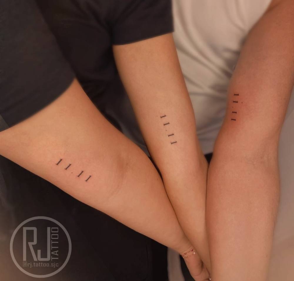 Matching angel number "11:11" tattoo for best friends.
