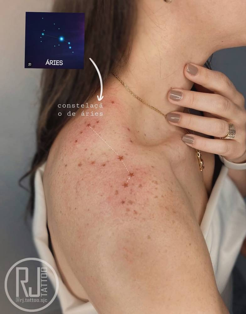 Aries constellation tattoo located on the top of shoulder.