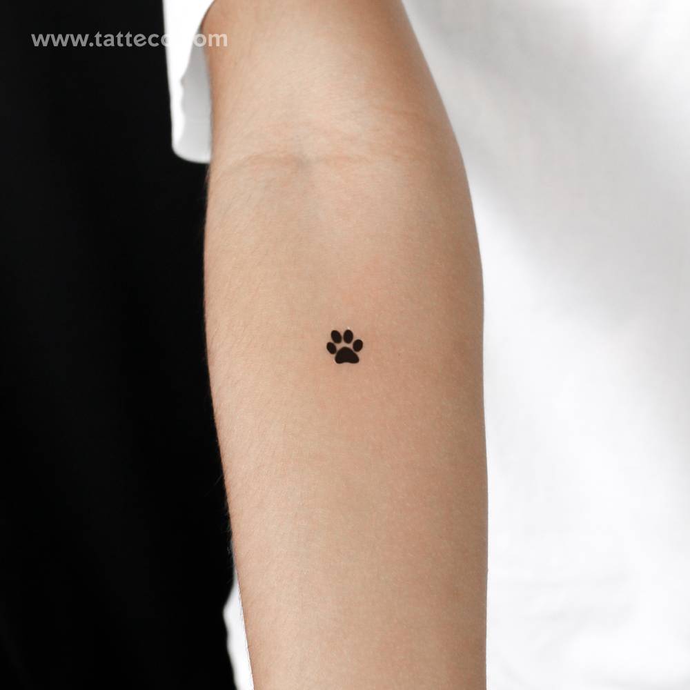 Paw print semi-permanent tattoo located on the inner forearm.