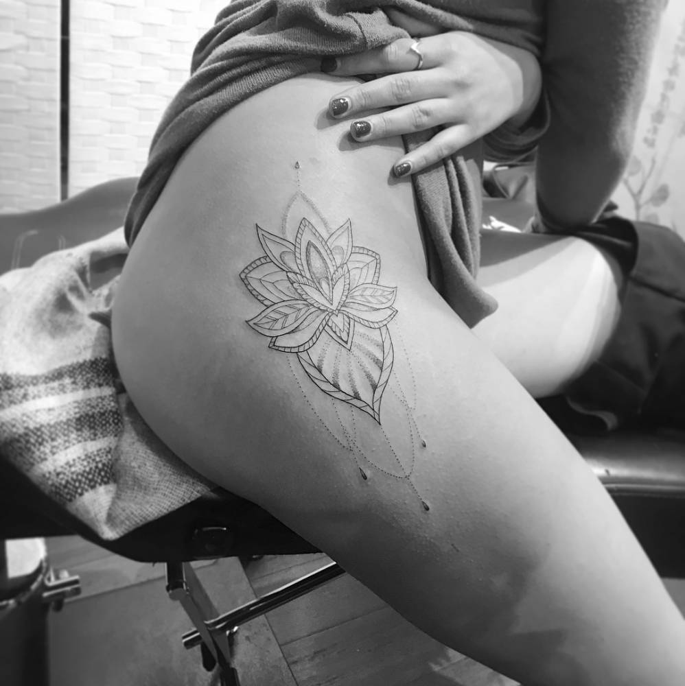 Mandala tattoo done on the hip.