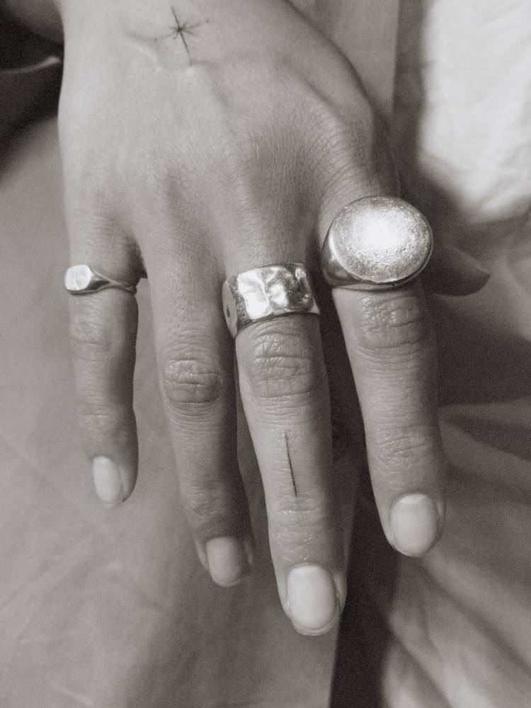 Tiny minimalistic line tattooed on the finger.