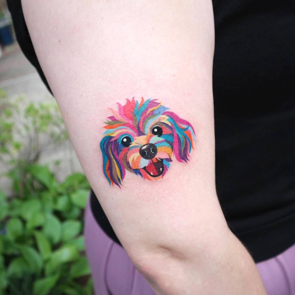 Shih-Tzu portrait tattoo in pop art style located on the upper arm.