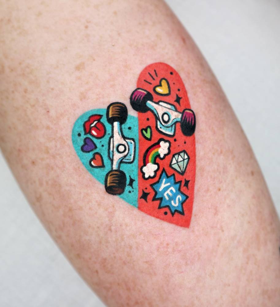 Skateboard heart tattoo located on the inner forearm.