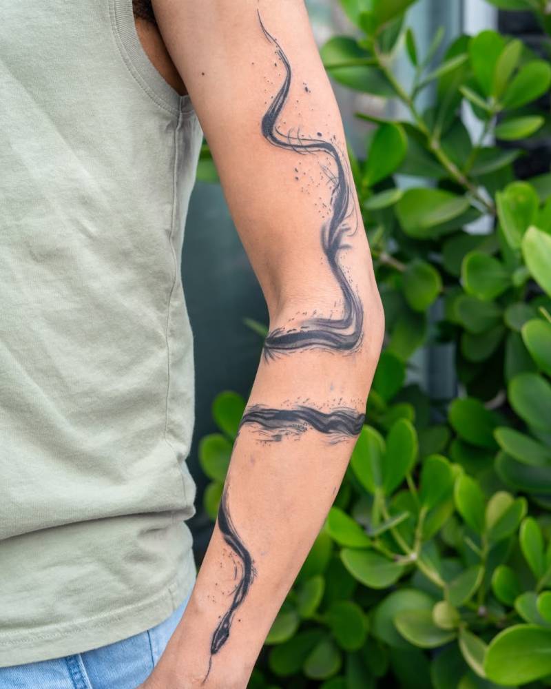 Wrap around abstract snake tattoo in watercolor style.