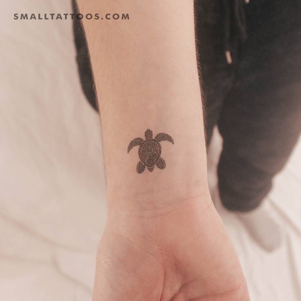 Tribal sea turtle temporary tattoo located on the wrist.