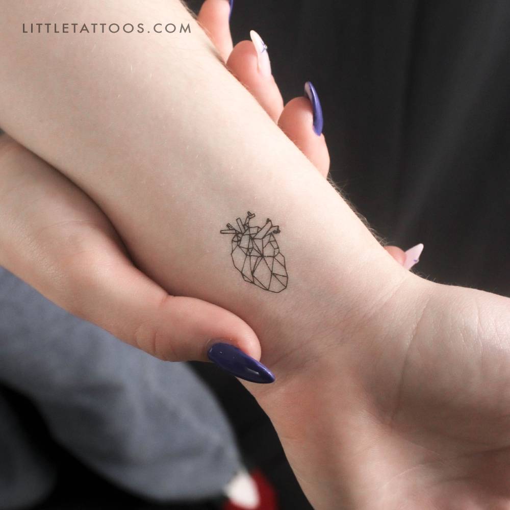 Low poly anatomical heart temporary tattoo located on the wrist.