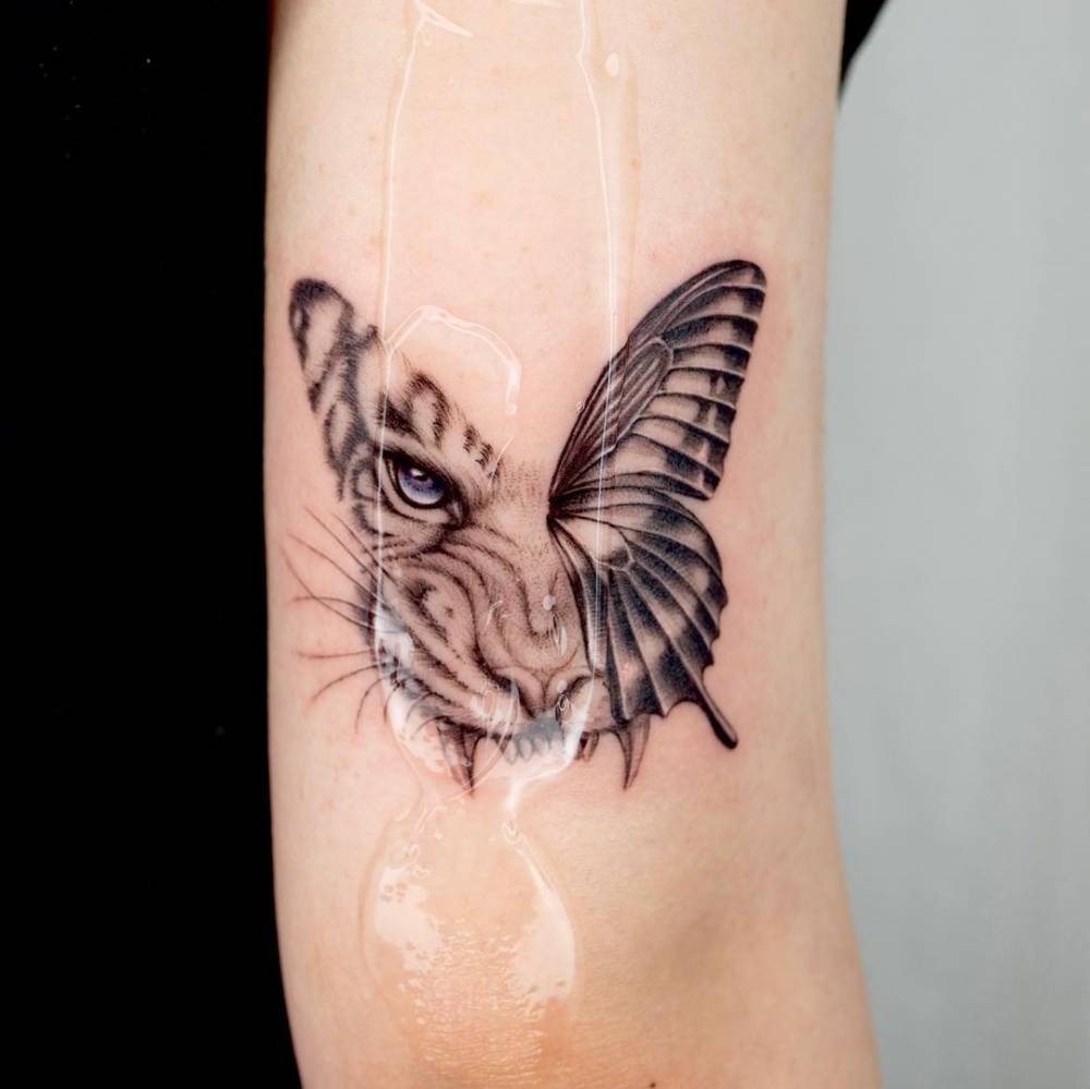 Tiger/butterfly tattoo on the tricep.o #colortattoo