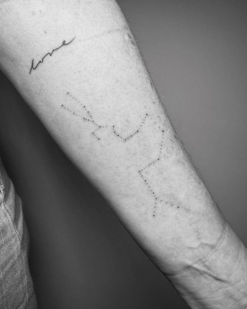 Taurus, Libra and Cancer constellations tattooed on the inner forearm.