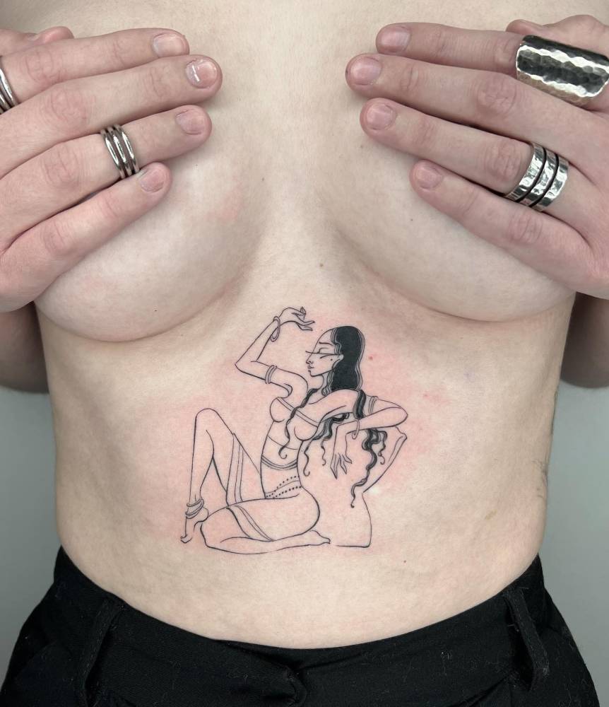 Woman tattoo in illustrative style done on the stomach.