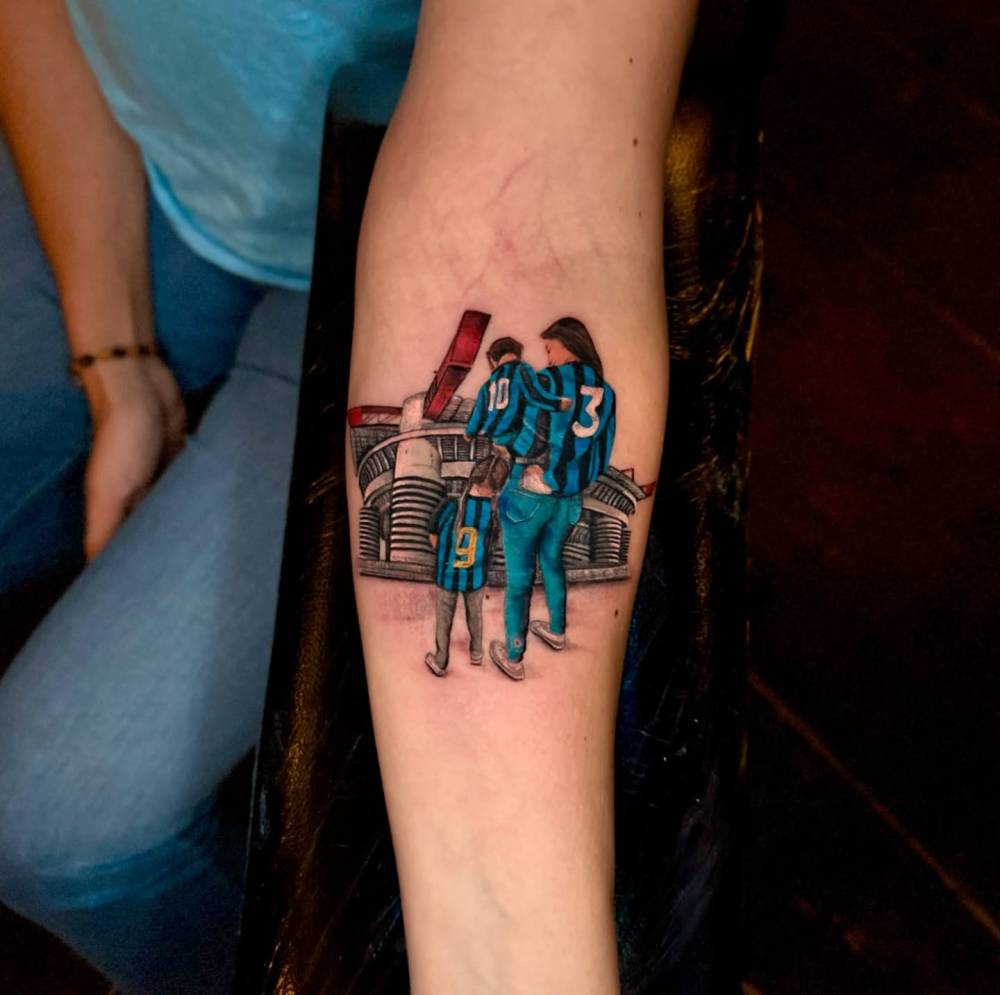 San Siro tattoo located on the inner forearm, illustrative style.