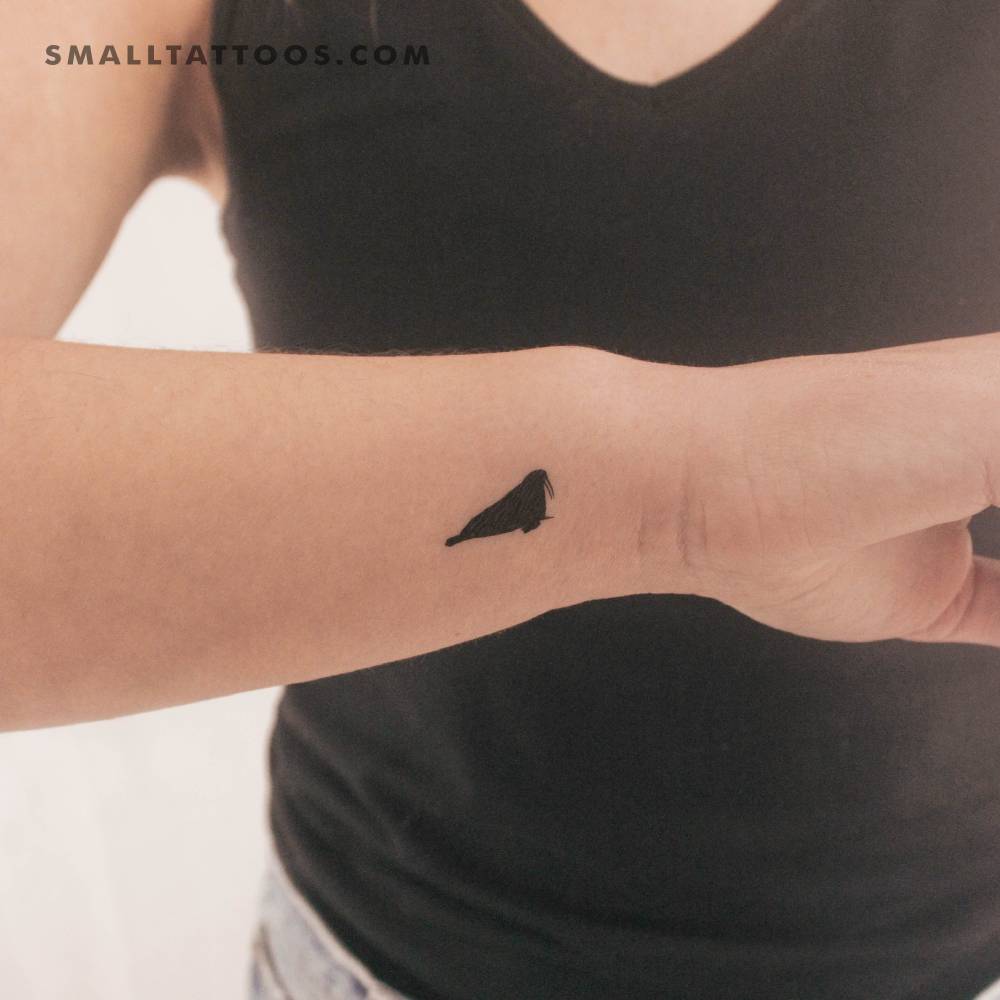 Walrus temporary tattoo in minimalistic style.