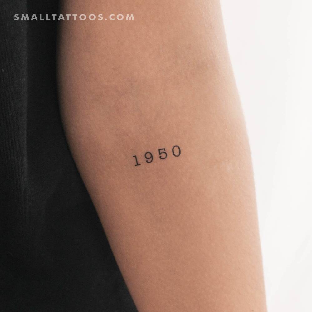 "1950" birth year temporary tattoo located on the inner forearm.