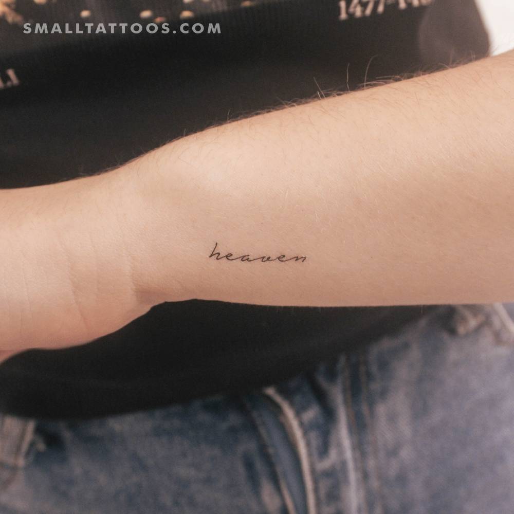 Handwritten font word "heaven" temporary tattoo located on the wrist.