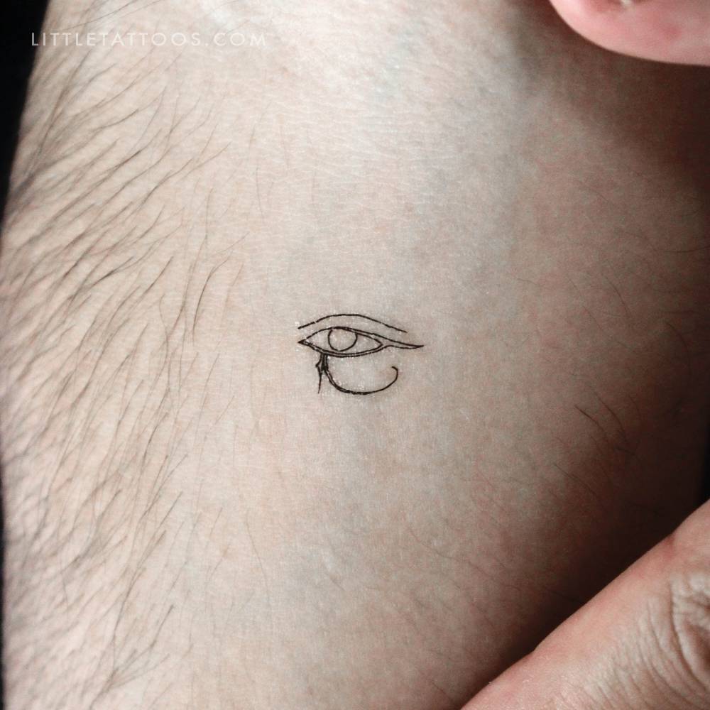 Fine line Eye Of Horus temporary tattoo located on the inner forearm.
