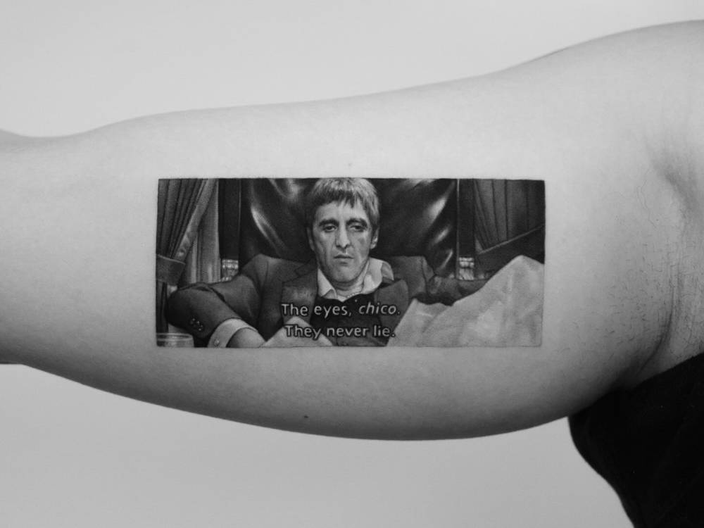 Scarface tattoo located on the inner arm, done in micro-realism.