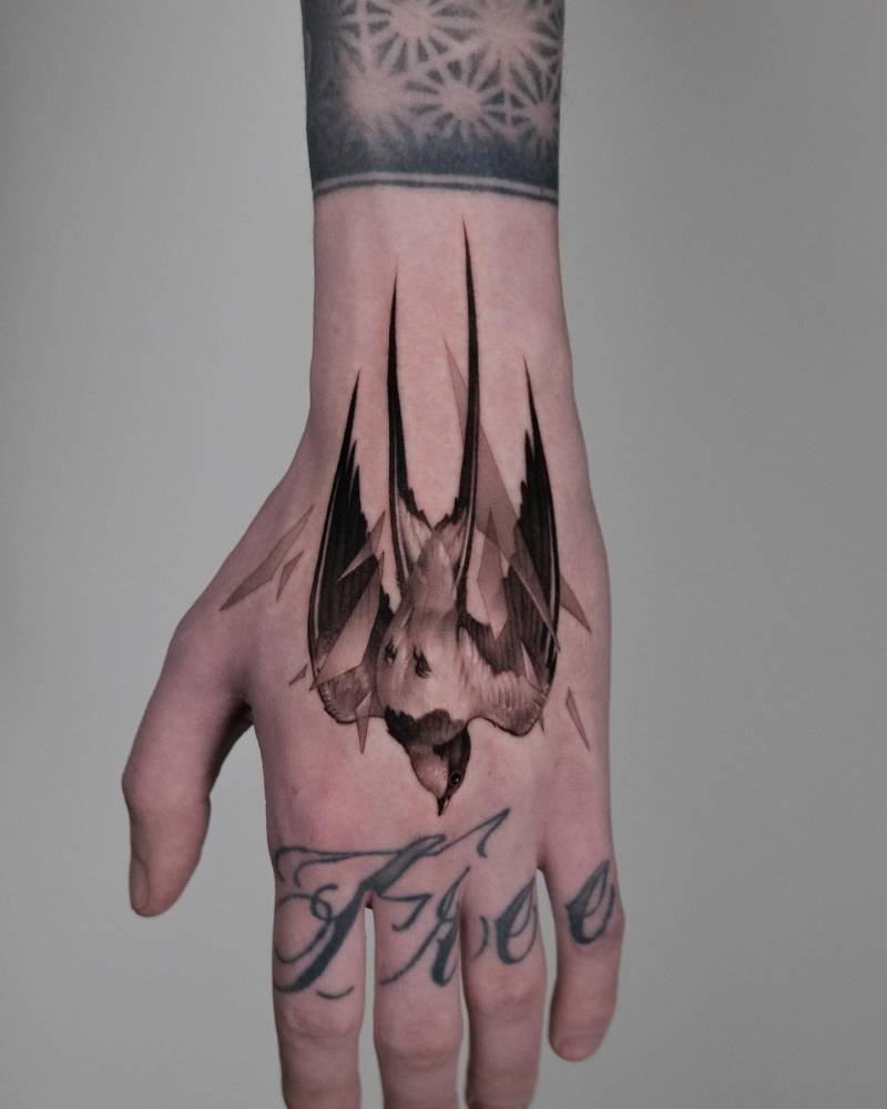 Swallow tattoo in micro-realism done on the hand.