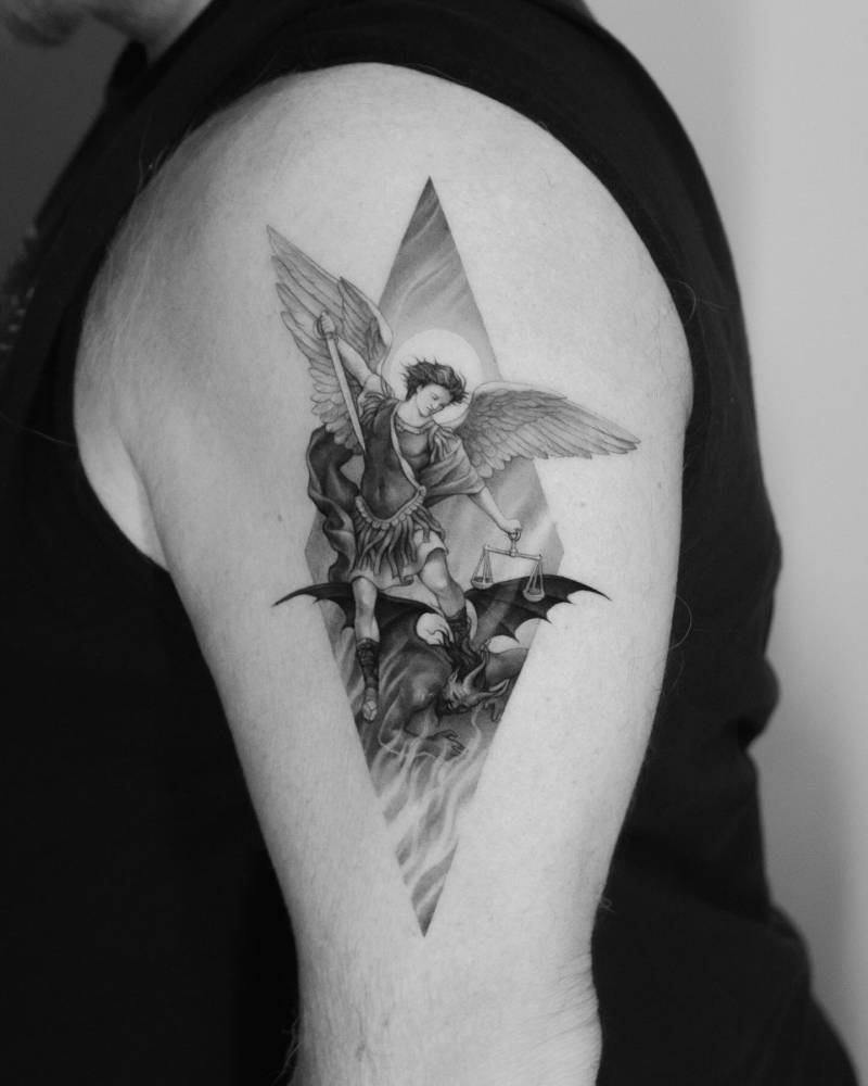 'Archangel Michael Defeating Satan' tattooed on the upper arm.
