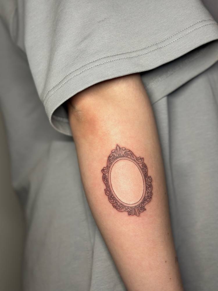 Frame tattoo located on the forearm.