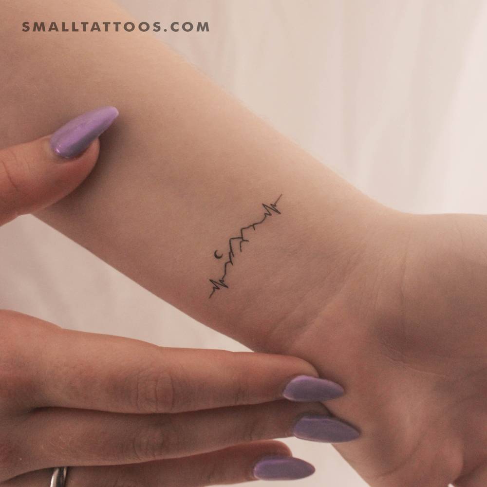 Mountain heartbeat temporary tattoo located on the wrist.