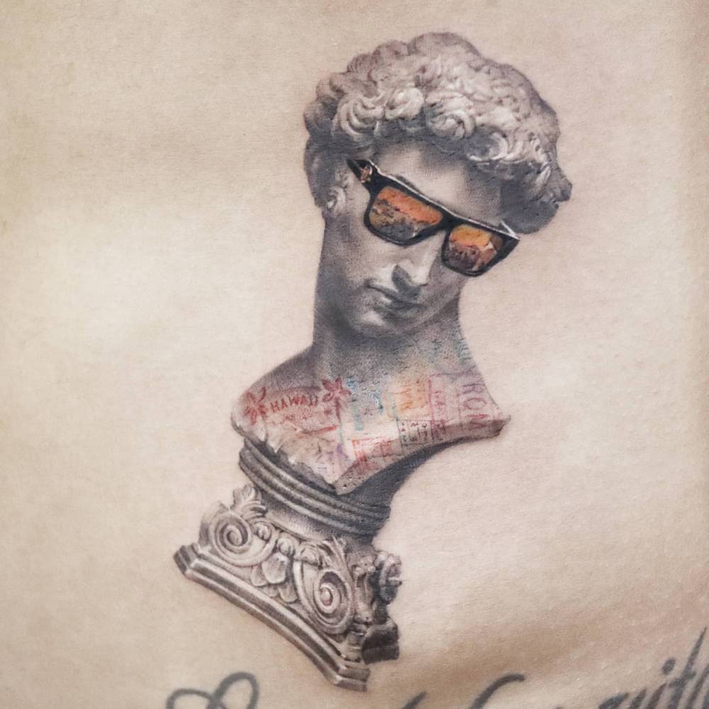 David wearing sunglasses tattooed on the waist.