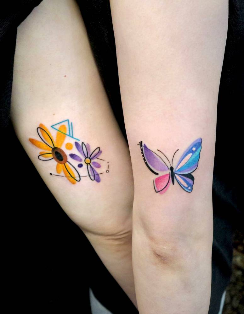 Flowers and butterfly tattoos in watercolor style.