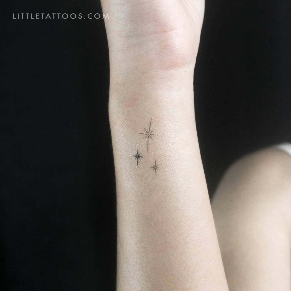 Three sparkles temporary tattoo located on the wrist.
