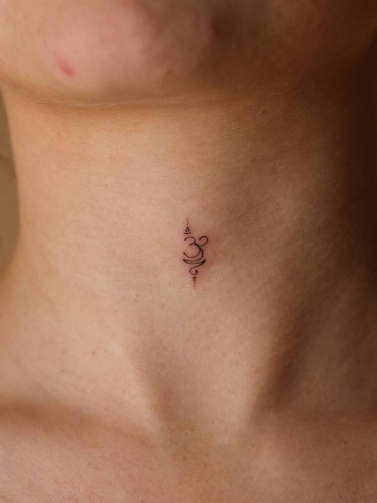 Symbol for "breathe" tattooed on the throat, done in minimalistic style.