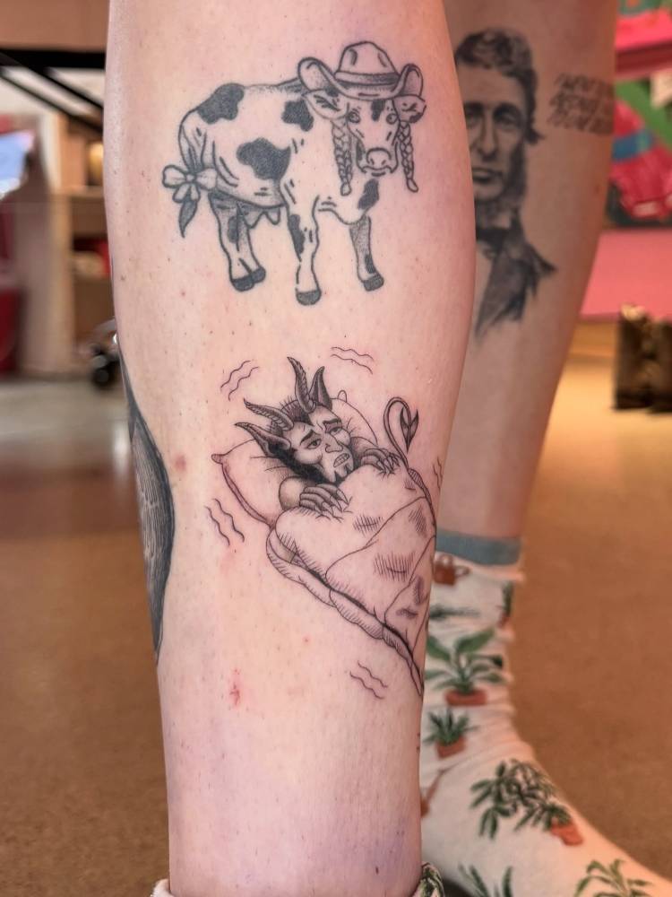 Cold devil tattoo located on the shin, done in illustrative style.