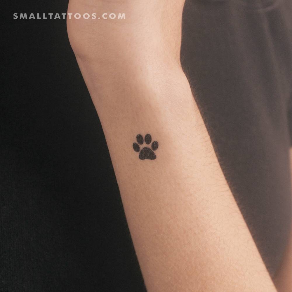 Pet waw print temporary tattoo located on the wrist.