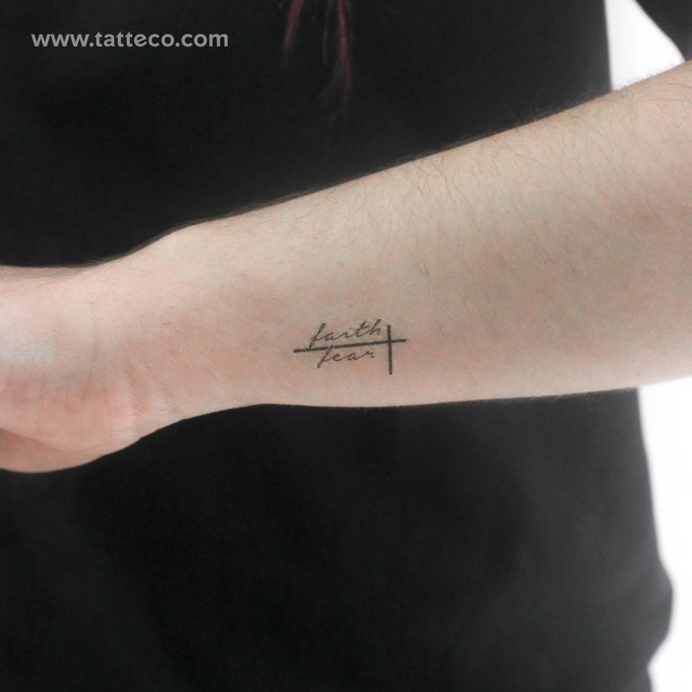 Small "faith over fear" temporary tattoo placed on the wrist.