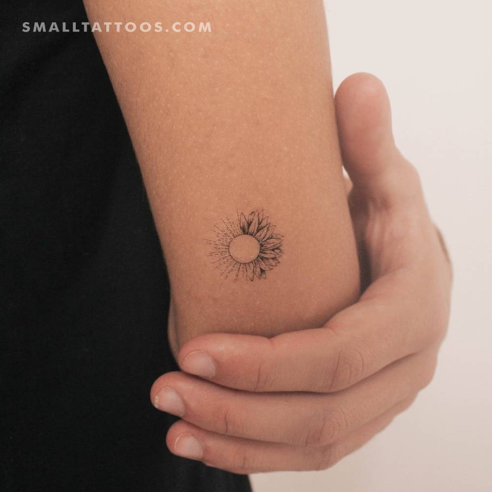 Sunflower sun temporary tattoo located on the tricep.