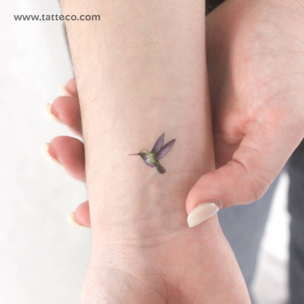 Watercolor style hummingbird temporary tattoo located on the wrist.
