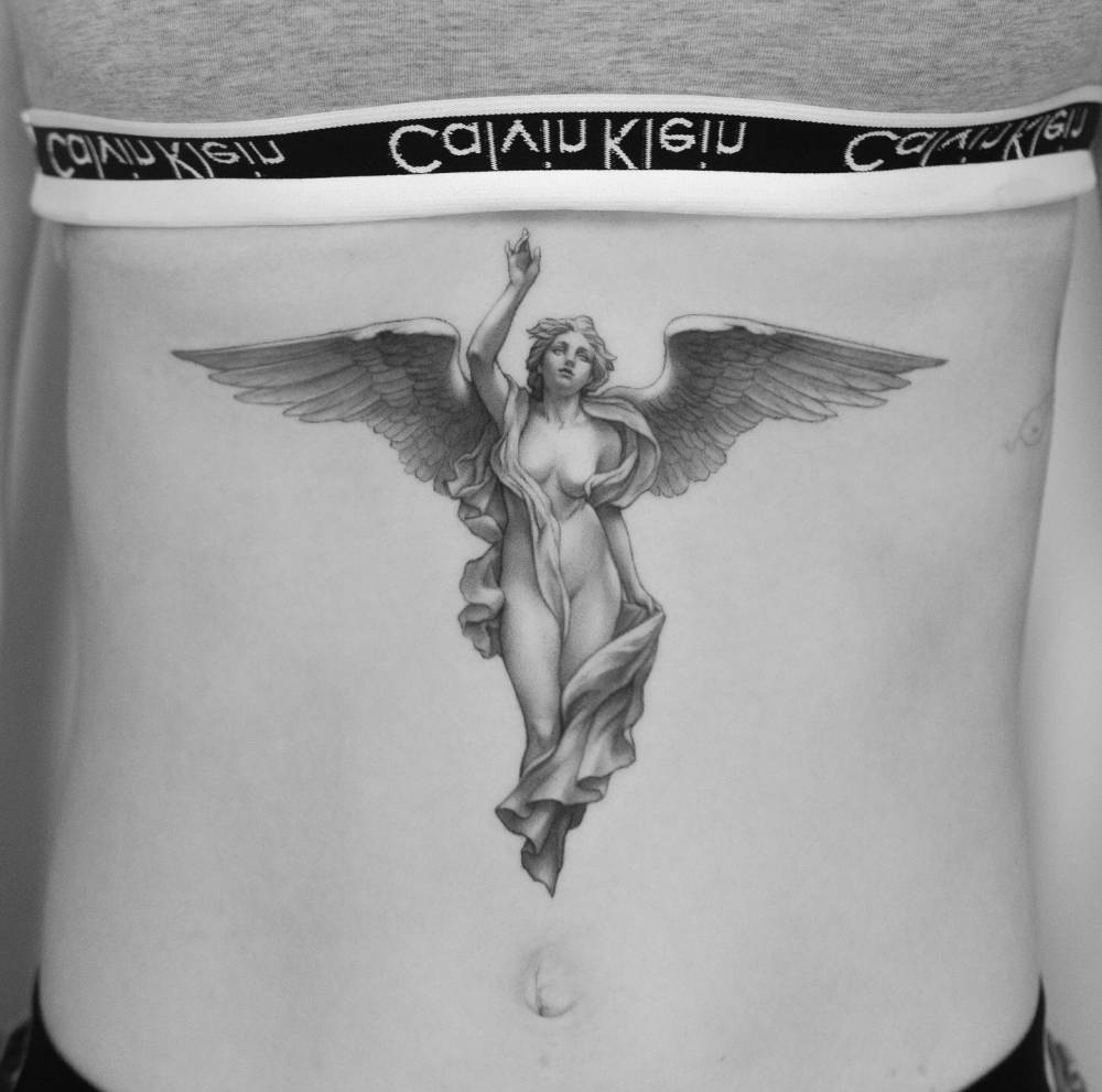Angel tattoo in classical style located on the stomach.