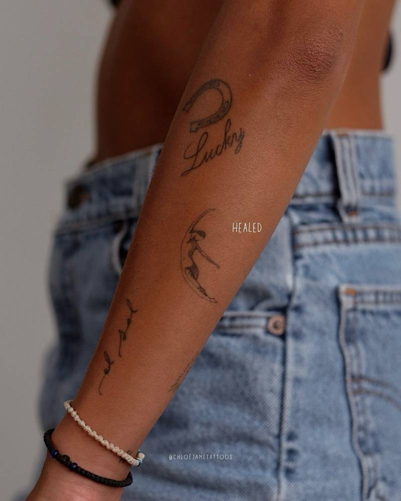 Healed crescent lady tattoo located on the forearm.
