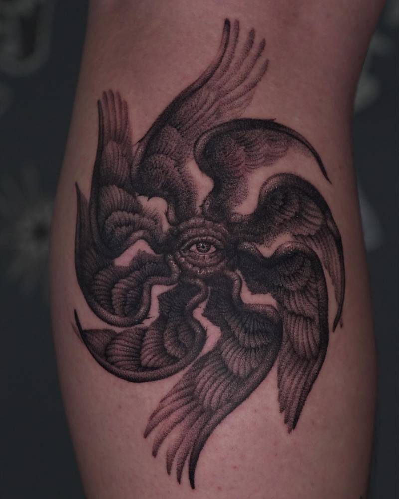 Seraphim tattoo in illustrative style located on the calf.