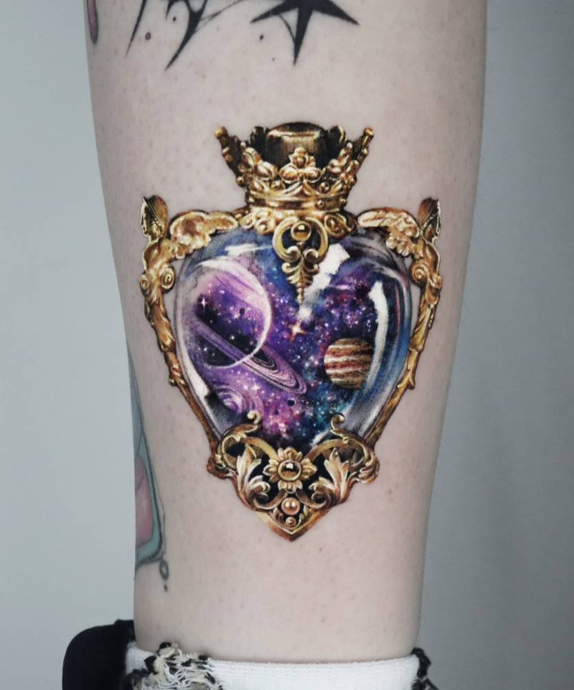 Galaxy potion tattoo located on the shin, micro-realistic style.