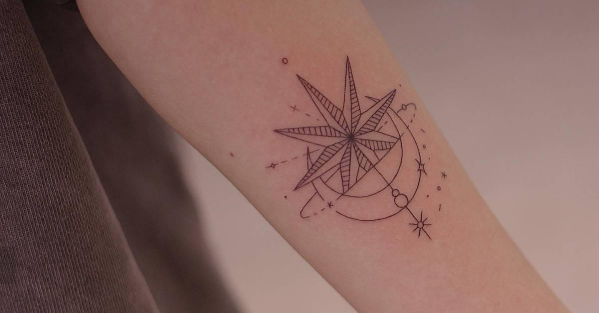 Fine line style ornamental star tattoo located on the
